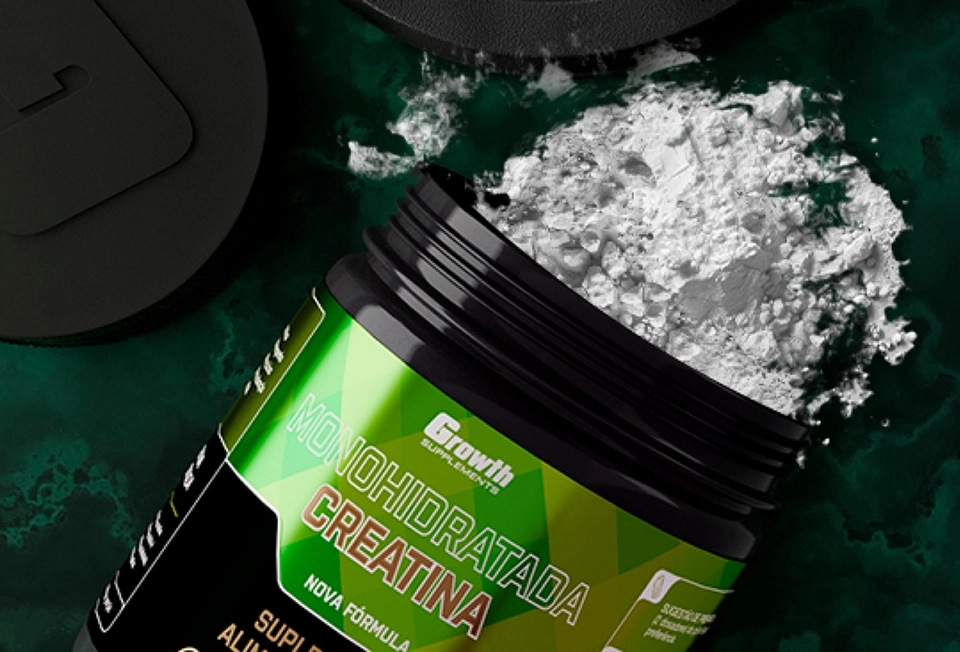 Growth Supplements - pote de creatina aberto com pó branco visível